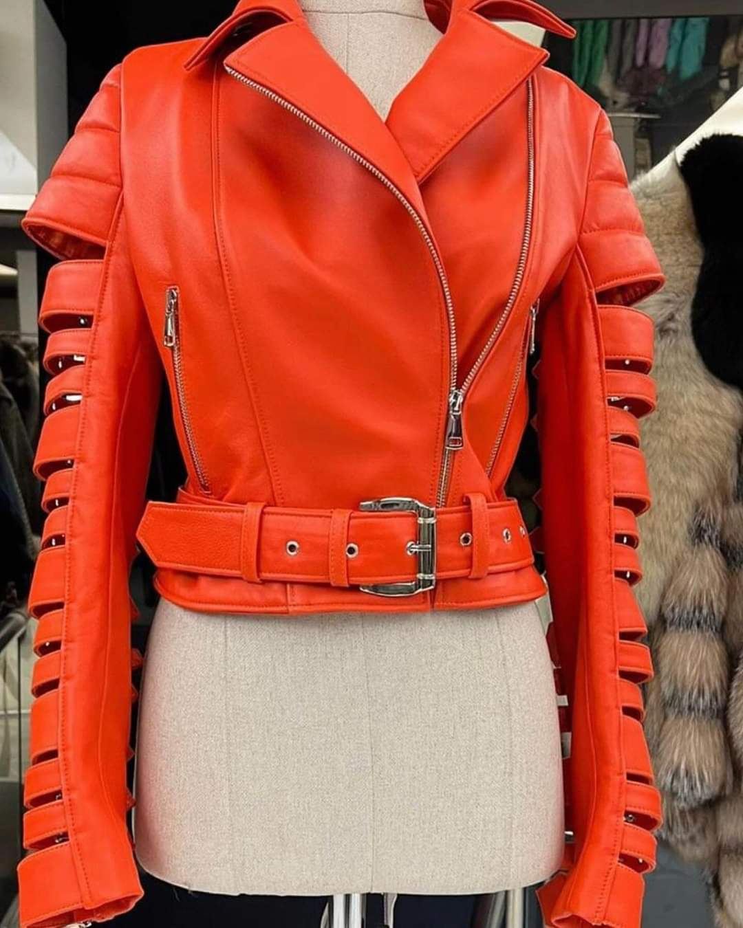 Orange leather biker jacket with cut-out paneled sleeves