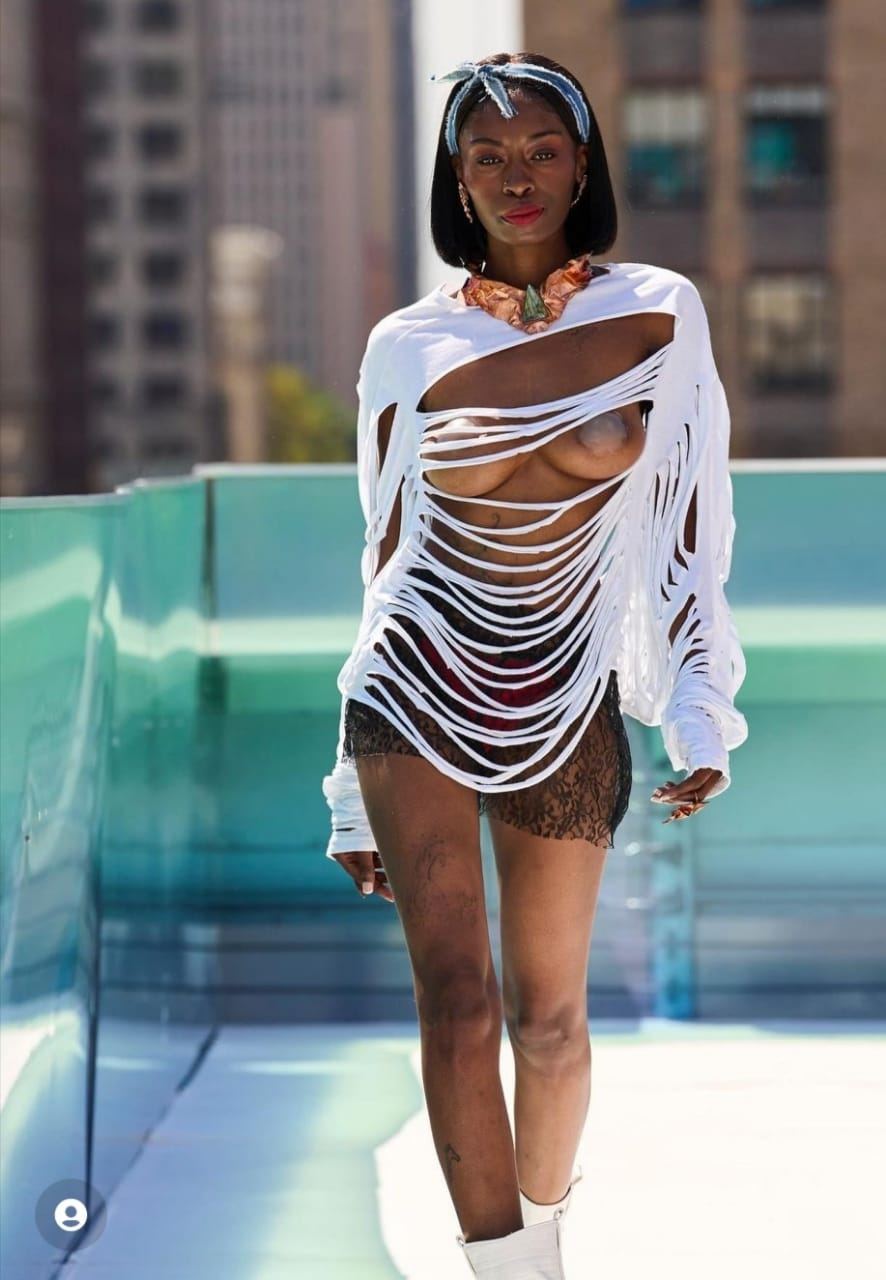 Runway look, shredded white knit top