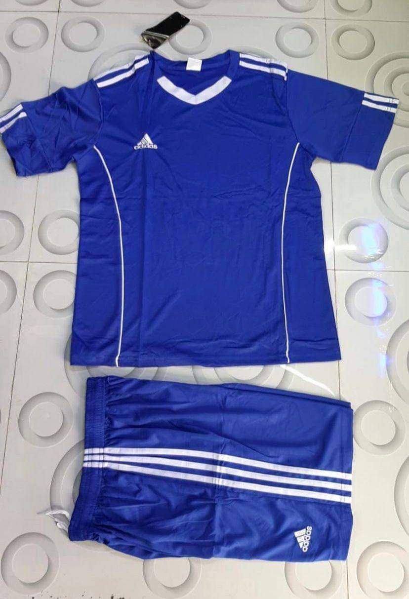 Blue football kit with white stripe detailing