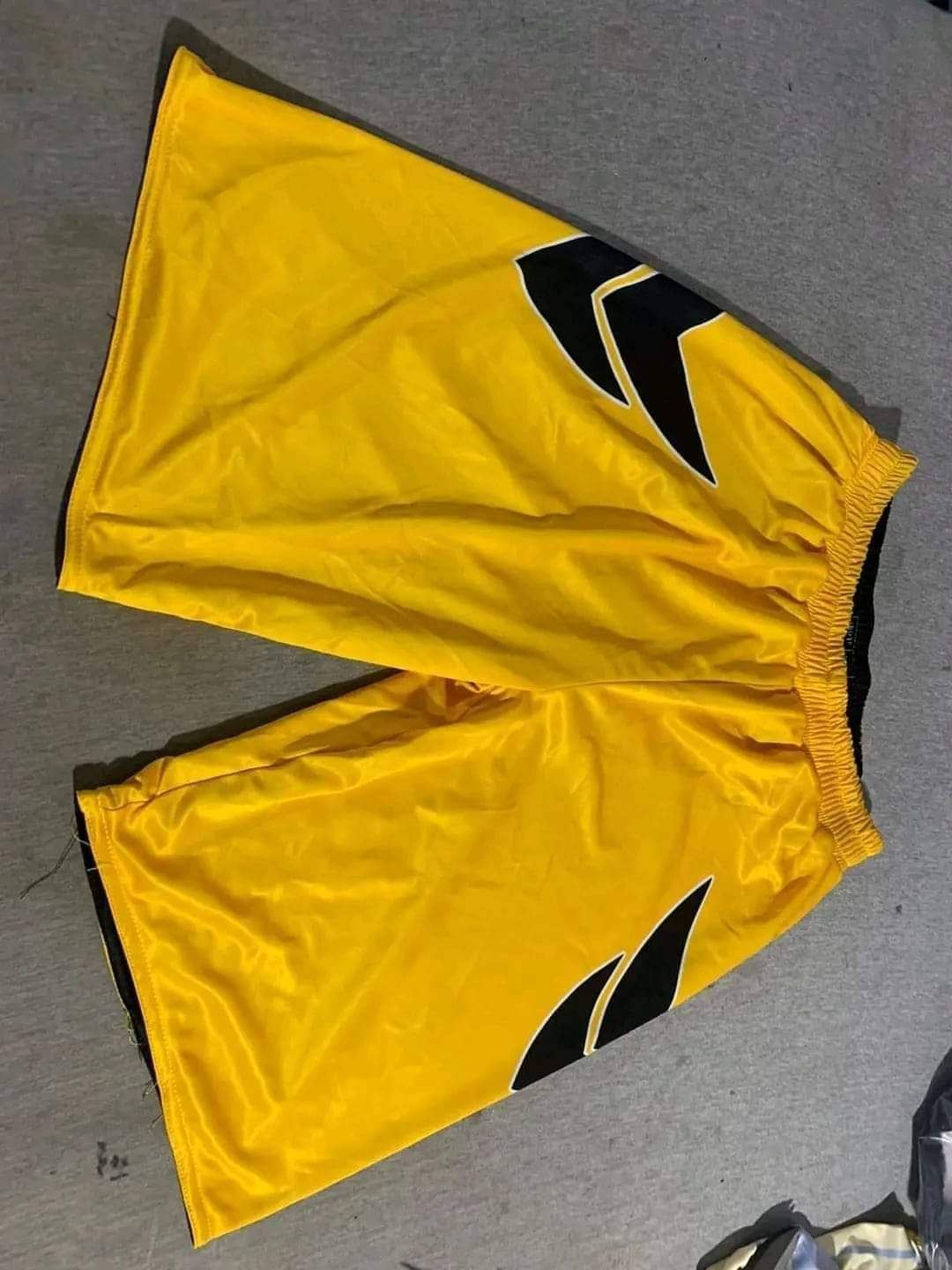 Yellow and black basketball shorts