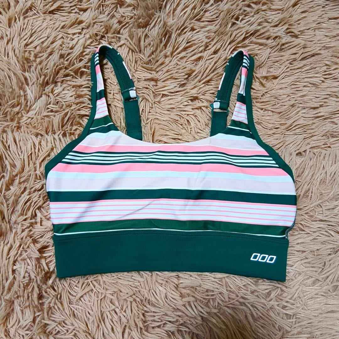 Green and pink striped sports bra